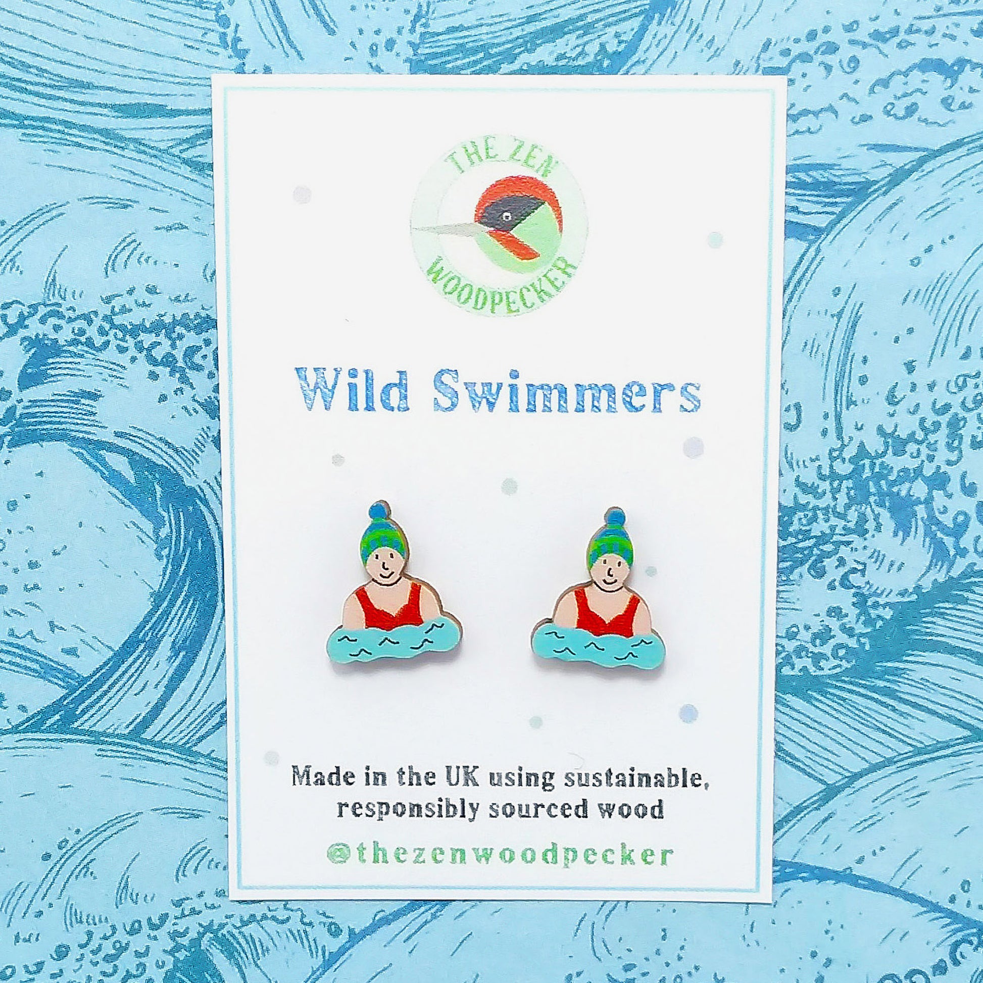 Wooden wild swimmer stud earrings on display card