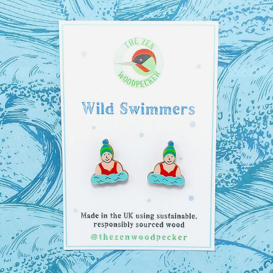 Wooden wild swimmer stud earrings on display card
