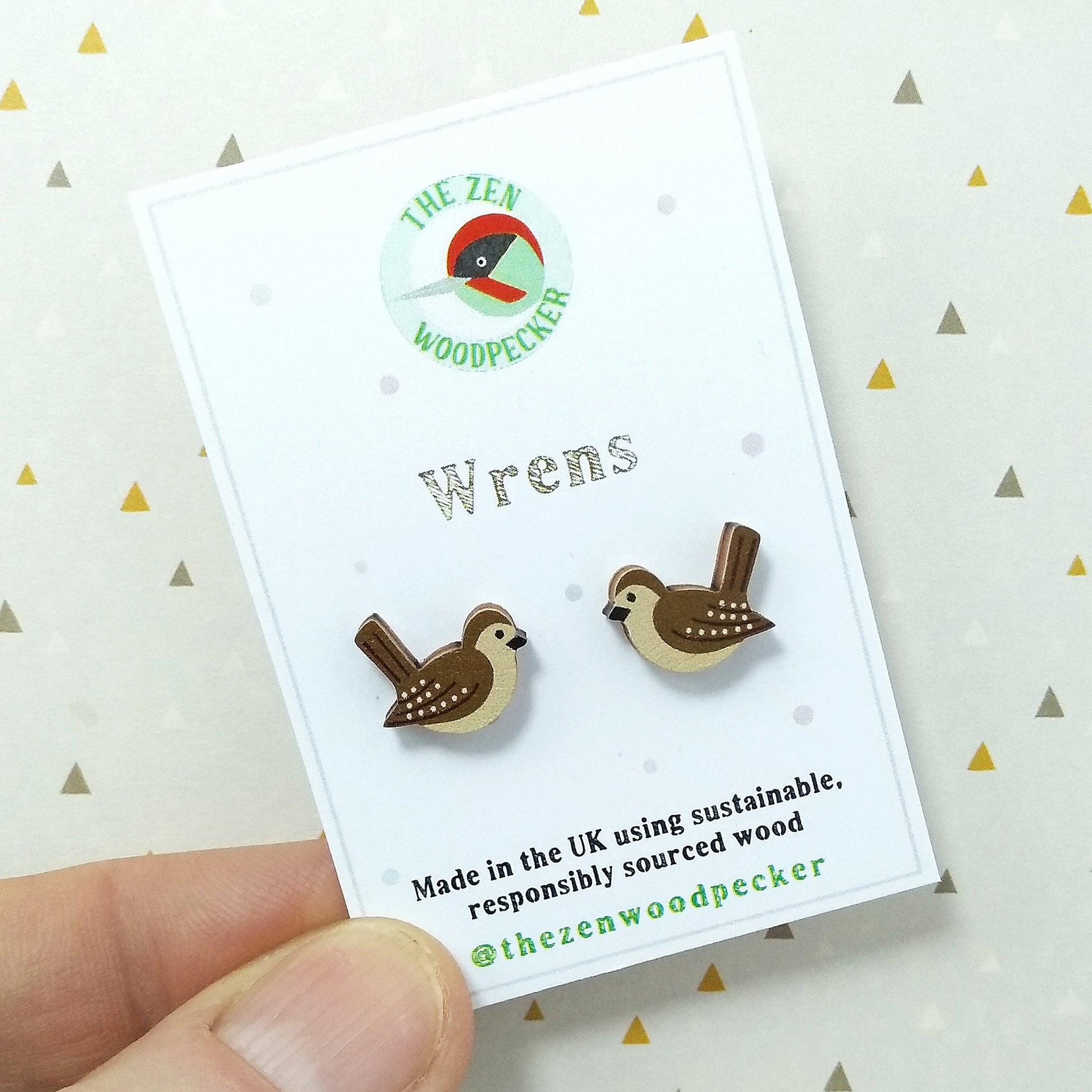 Wooden wren stud earrings on display card