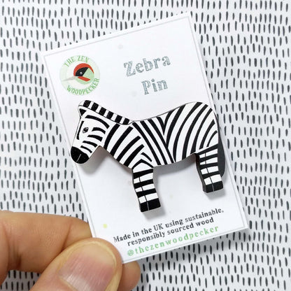 Wooden zebra pin badge on display card